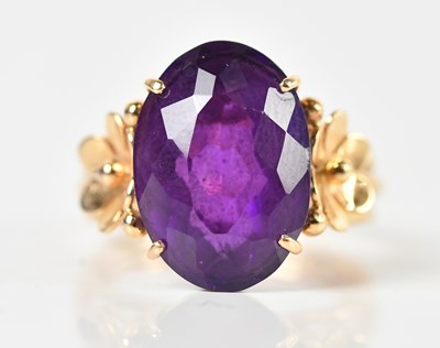 Lot 95 - A yellow metal amethyst dress ring, the oval...