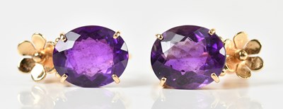 Lot 289 - A pair of yellow metal amethyst screw back...