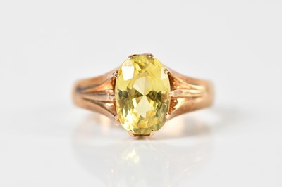 Lot 1335 - A yellow metal yellow sapphire set dress ring,...