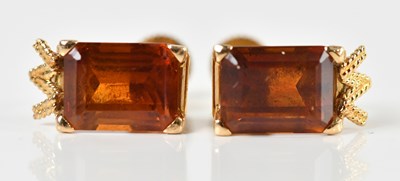 Lot 1684 - A pair of yellow metal screw back ear studs,...