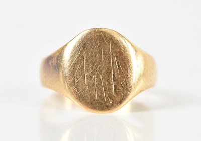 Lot 1523 - A small yellow metal signet ring, with traces...
