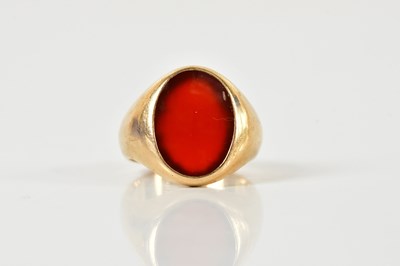 Lot 1336 - A yellow metal carnelian signet ring, size N...