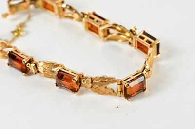 Lot 1549 - A yellow metal bracelet, set with satin finish...