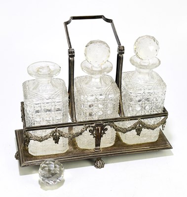 Lot 2011 - An Edwardian silver plated three bottle...