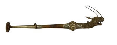 Lot 1191 - A Tibetan copper and brass wall hanging horn,...