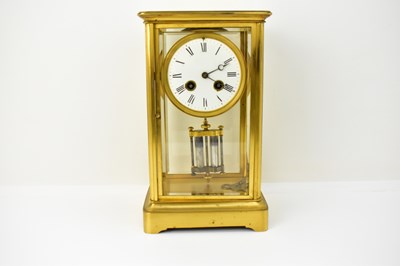 Lot 76 - A large French brass cased table clock, with...