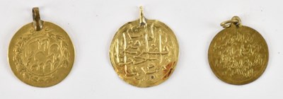 Lot 1602 - Three Arabic yellow metal coins mounted as...