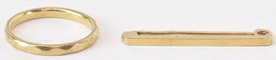 Lot 1520 - A 9ct gold band ring, size N, and a small 9ct...