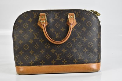 Lot 2033 - LOUIS VUITTON; an Alma PM Monogram coated...