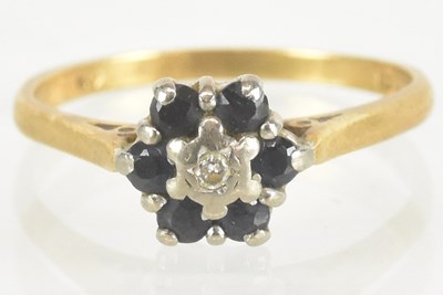 Lot 1437 - An 18ct yellow gold diamond and sapphire set...