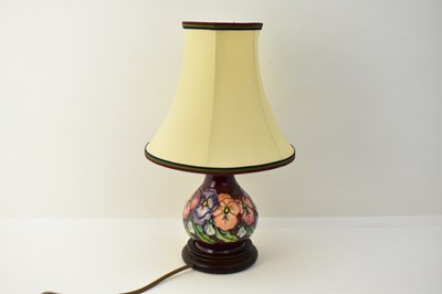 Lot 567 - MOORCROFT; a modern tube lined pottery lamp,...