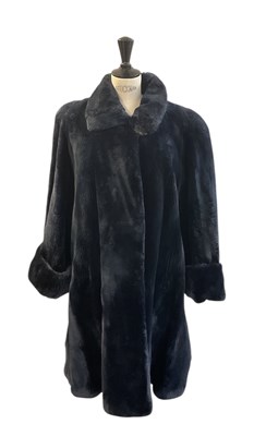 Lot 486 - A navy blue shaved beaver fur coat.