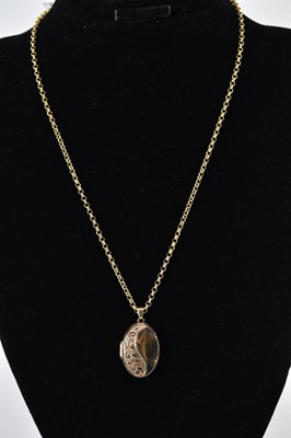 Lot 1475 - A modern 9ct gold oval double locket, with...