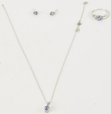 Lot 1476 - A suite of 9ct white gold white and blue stone...