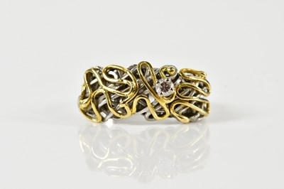 Lot 1319 - An 18ct white and yellow gold ring of unusual...