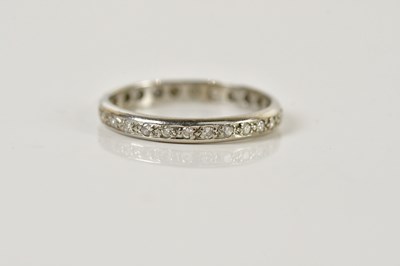 Lot 134 - A white metal diamond set full eternity ring,...