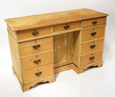 Lot 79a - A rustic pine desk, the three-drawer top above...