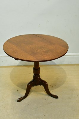 Lot 2290 - An 18th century oak tripod table, height 71cm.