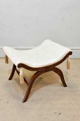 Lot 2419 - A carved oak X-framed stool, upholstered in a...