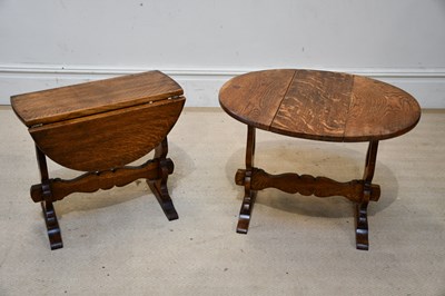 Lot 2421 - A pair of early 20th century drop-leaf swivel...