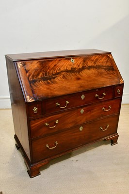 Lot 2251 - A Georgian inlaid mahogany bureau, the fall...