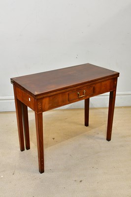 Lot 2370 - A Georgian inlaid mahogany fold-over tea table,...