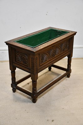 Lot 2454 - An early 20th century carved oak jardinière...