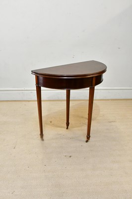Lot 2426 - An early 20th century mahogany demi-lune...