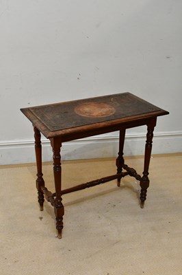 Lot 2424 - An early 20th century carved oak side table in...