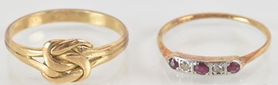 Lot 1443 - A yellow metal ruby and diamond set ring, size...