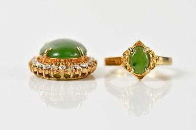 Lot 1445 - A yellow metal pendant set with green...