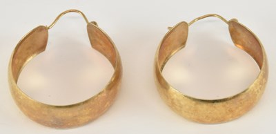 Lot 1552 - A pair of 9ct yellow gold hoop earrings,...