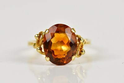 Lot 1480 - An 18ct yellow gold citrine dress ring, with...