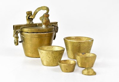 Lot 359 - A set of Nuremberg brass apothecary weights...