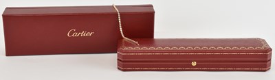 Lot 1349 - CARTIER; a 18ct yellow gold diamond set tennis...