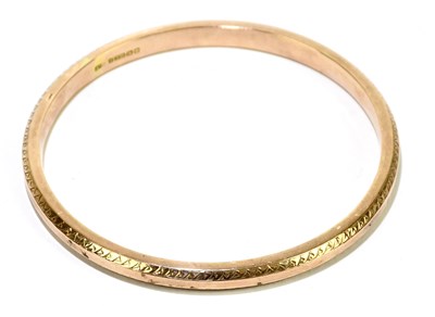 Lot 1269 - A 9ct rose gold fixed bangle, internal width...