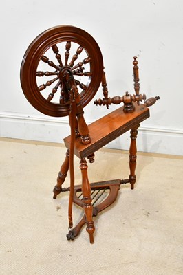 Lot 2430 - A 19th century carved fruitwood spinning wheel,...