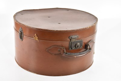 Lot 2619 - A vintage circular hat box with leather handle,...