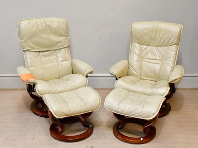 Lot 2460 - A pair of Stressless style leather chairs, one...