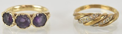 Lot 1399 - A 9ct yellow gold amethyst set three stone...