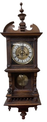 Lot 113 - An early 20th century walnut cased wall clock,...