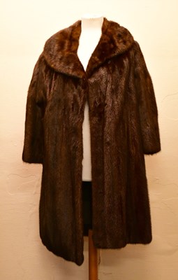 Lot 1959 - HURTIG FURRIERS, CALGARY; a full length dark...