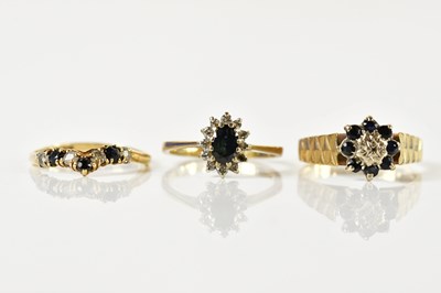 Lot 1333 - Three 9ct yellow gold sapphire dress rings,...
