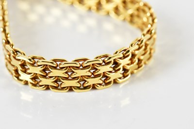 Lot 1533 - An 18ct yellow gold flat link chainmail...