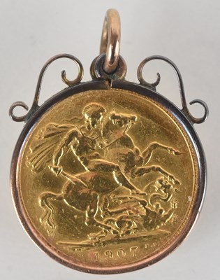 Lot 1571 - An Edward VII 1907 full sovereign, in 9ct gold...