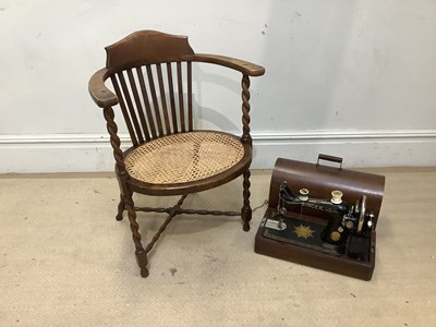 Lot 2433 - A 1930s barley twist oak armchair and a Singer...