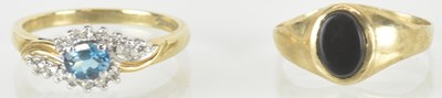 Lot 1514 - Two 9ct gold dress rings, one with centre blue...