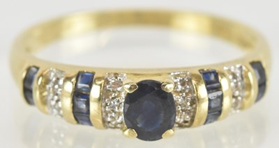 Lot 1515 - A 14ct gold sapphire and diamond set dress...