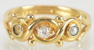 Lot 1483 - An 18ct gold ring with central claw set...