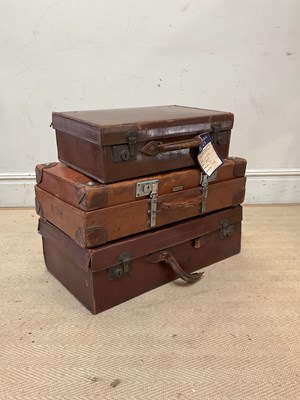 Lot 1938 - Three vintage brown leather suitcases...